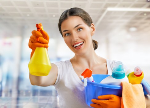 Cleaner working in a Richmond home with careful attention to detail