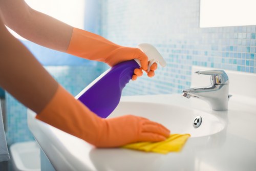 Cleaning professional reviewing safety measures during a deep cleaning job in Richmond