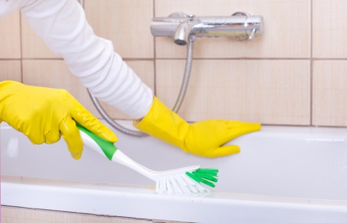 Trained cleaner using PPE while carrying out a professional deep cleaning service