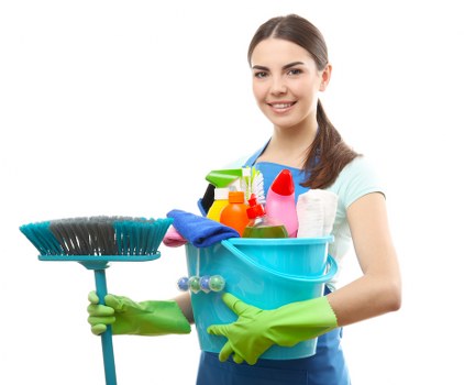 Technician wearing PPE while handling cleaning chemicals